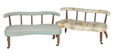 A companion pair of Victorian low sofas or window seats, late 19th century, later upholstered in