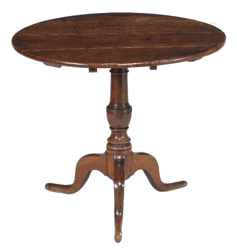 A George II oak tripod table, mid-18th century, 69cm high, 80cm diameter