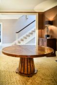 An elm extending dining table, by William Yeoward, of recent manufacture, 'Capstan' pattern, with