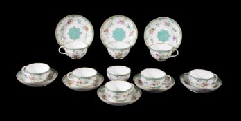 Eight Meissen (Punkt) teacups and saucers, circa 1770, painted with flowers within rococo borders,