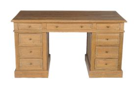 An oak twin pedestal desk, late 20th century, by OKA, 'William' pattern, 81cm high, 150cm wide, 78cm