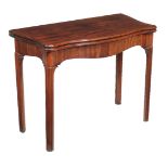 A George III mahogany folding tea table, circa 1780, of serpentine outline, 72cm high, 94cm wide,