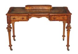 A Victorian walnut writing table, circa 1870, the back with lift-top stationary compartment, 79cm