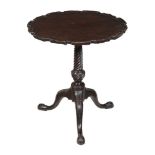 A George III carved mahogany tripod table, circa 1770, with 'piecrust' edge, 71cm high, the top 65cm