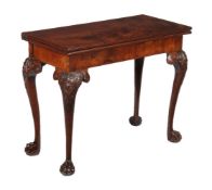 A George II mahogany card table, circa 1740, possibly Irish, the folding top opening to baize