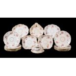 A Coalport part dessert service, circa 1825, painted with flowers within relief moulded and gilt