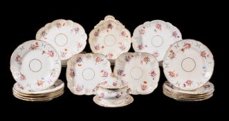A Coalport part dessert service, circa 1825, painted with flowers within relief moulded and gilt