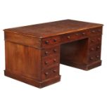 A Victorian mahogany pedestal desk, mid 19th century, the leather writing surface above three frieze