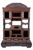 A lacquered and inlaid wood Shodana, comprising shelves, drawers and cupboards, carved with