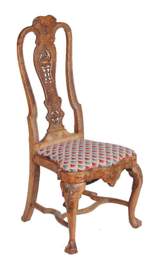 A George II carved walnut chair, circa 1730, after the manner of Daniel Marot, with drop in seat,