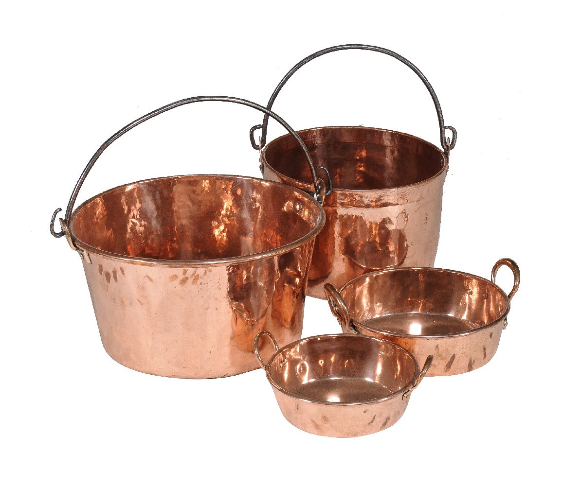 Four various copper vessels, 18th and 19th century, the largest with wrought iron swing handle, 34