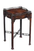 A mahogany occasional table, in George III style, 19th century, the serpentine sided spindle