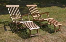 A pair of teak 'steamer' reclining chairs, modern, of slatted construction