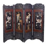 ϒ A Japanese Four-Fold Wood Screen, early 20th century, the frame carved with reserves of peonies