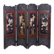 ϒ A Japanese Four-Fold Wood Screen, early 20th century, the frame carved with reserves of peonies