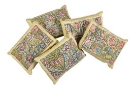 A set of five satin and early 18th century style needlework fronted cushions, of rectangular form,