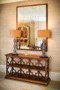 A pair of silvered composition table lamps, of recent manufacture, by Porta Romana, in the form of