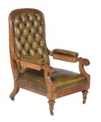 A Victorian green leather upholstered library armchair, circa 1870, with reclining action after