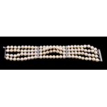 A cultured pearl and diamond bracelet, the four rows of uniform cultured pearls, measuring