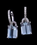 A pair of aquamarine and diamond earrings, the rectangular cut aquamarines in a four claw setting,