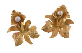 A pair of cultured pearl flower head earrings, designed as orchids, each set with a cultured