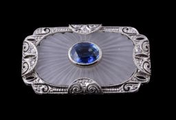 An Art Deco sapphire, rock crystal and diamond brooch/pendant, circa 1930, the rectangular panel
