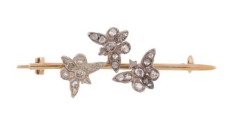 An early 20th century diamond butterfly brooch, the three butterflies set with rose cut diamonds, on