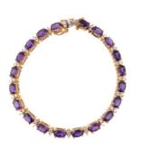 An amethyst and diamond bracelet, set with alternating oval cut amethysts and duos of brilliant