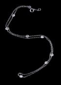 A diamond necklace, composed of belcher links with interspersed brilliant cut diamonds in