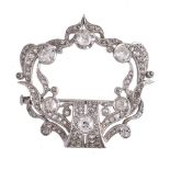 A diamond cartouche brooch, the cartouche openwork panel set with old brilliant cut and rose cut