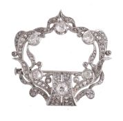 A diamond cartouche brooch, the cartouche openwork panel set with old brilliant cut and rose cut