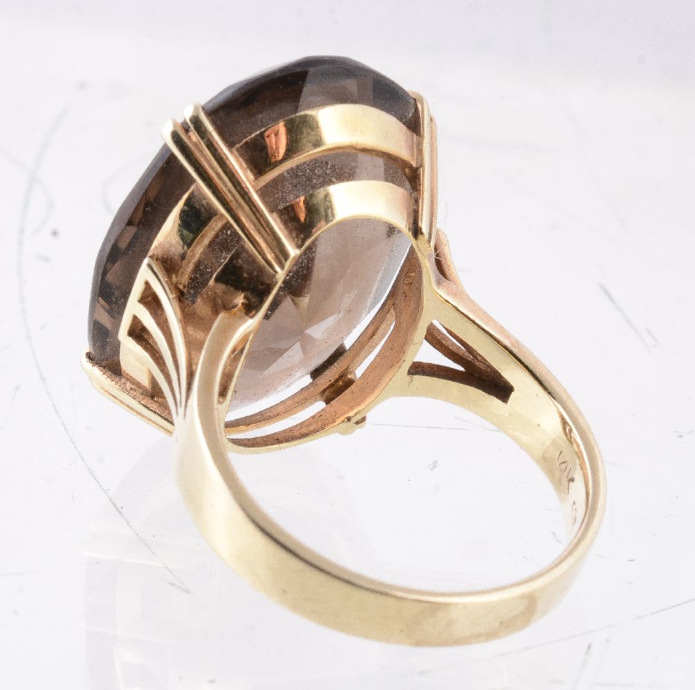 A 1970s smoky quartz dress ring, the oval cut smoky quartz in a claw setting, stamped 14k, finger - Image 2 of 2