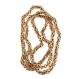 A gold fancy link coloured chain, composed of textured interwoven links, stamped 750, 129g, 72cm