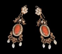 ϒ A pair of coral and freshwater cultured pearl earrings, the oval carved coral panel within a