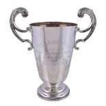 A silver two handled trophy cup by Alexander Clark & Co. Ltd, Birmingham 1922, with bifurcated