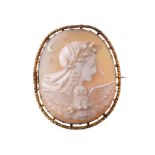 A Victorian shell cameo, circa 1870, the oval shell cameo carved with the profile of Nyx with