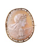 A Victorian shell cameo, circa 1870, the oval shell cameo carved with the profile of Nyx with