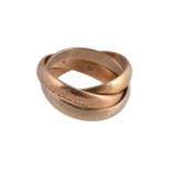 Cartier, Les Must de Cartier, an 18 carat gold trinity ring, with three intertwined bands, signed