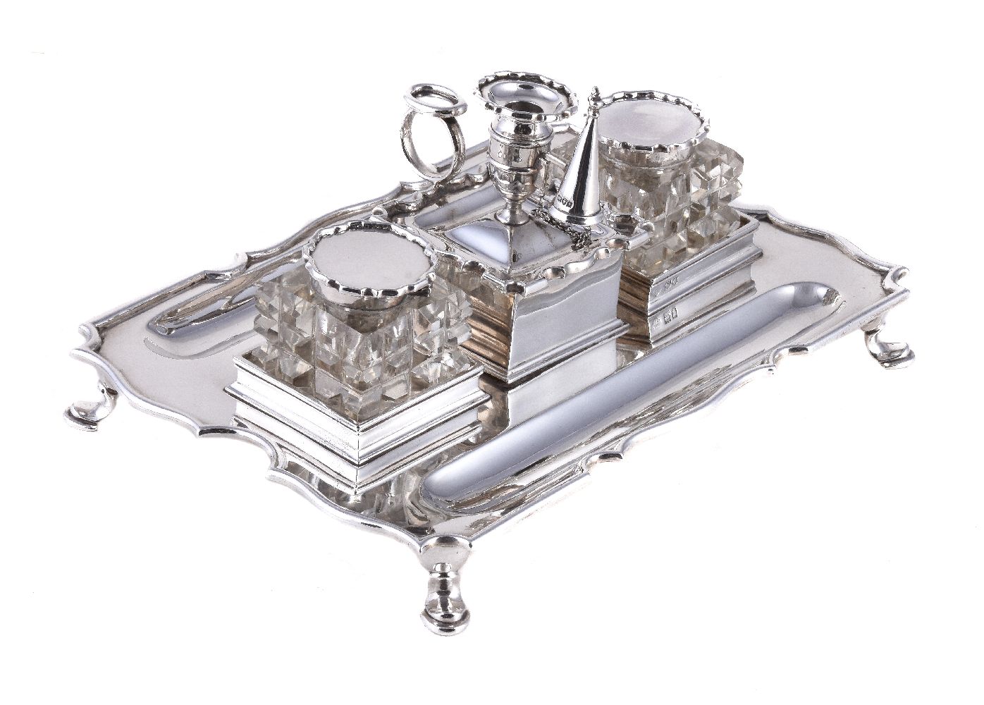 A silver shaped rectangular inkstand by The Goldsmiths & Silversmiths Co. Ltd, London 1910, with a