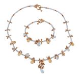 An aquamarine and citrine necklace, composed of facetted aquamarine beads with a fringe of