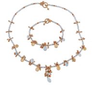 An aquamarine and citrine necklace, composed of facetted aquamarine beads with a fringe of
