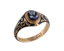 A William IV 18 carat gold sardonyx and enamel ring, the oval sardonyx panel carved with a forget-