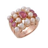A cultured pearl and ruby dress ring, the central oval cut ruby within a surround of cultured pearls
