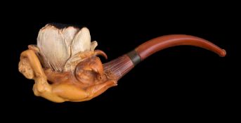 A meerschaum erotic pipe, early 20th century, carved with a nude woman, roses in her hair, beneath