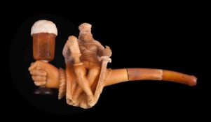 A meerschaum pipe/cheroot pipe, late 19th century, carved with a seated king with a hand holding the
