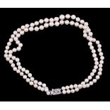 A two strand cultured pearl necklace, the slightly graduated cultured pearls, measuring 4mm to