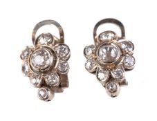 A pair of diamond ear clips, set with a cluster of old cut diamonds, approximately 0.65 carats