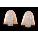 A pair of diamond earrings, the triangular shaped earrings, set with a panel of brilliant cut