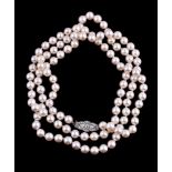 An opera length cultured pearl necklace with diamond clasp, the one hundred and fourteen cultured