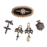 A late 19th century onyx and pearl brooch, the oval onyx panel set with an applied star set with